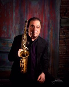 Portrait of Greg Abate with his saxaphone